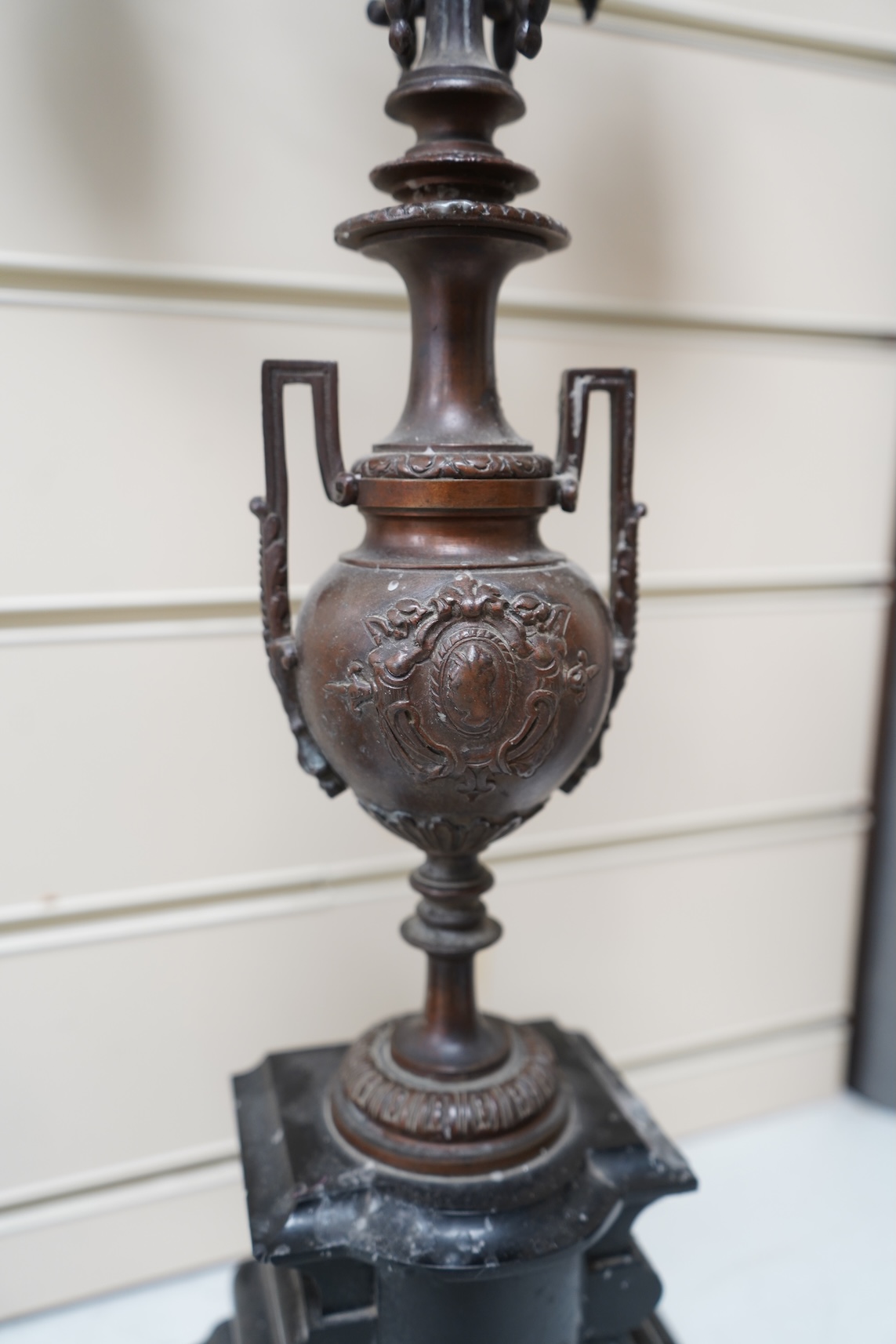 A pair of early 20th century bronze and black slate five light, four branch candelabra, 60cm high